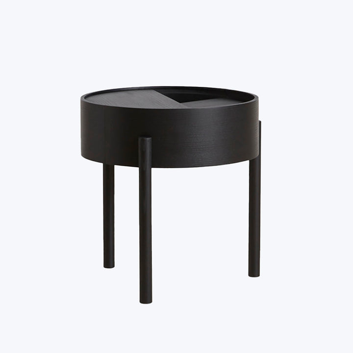 Modern black side table with tray-like top and cylindrical legs.