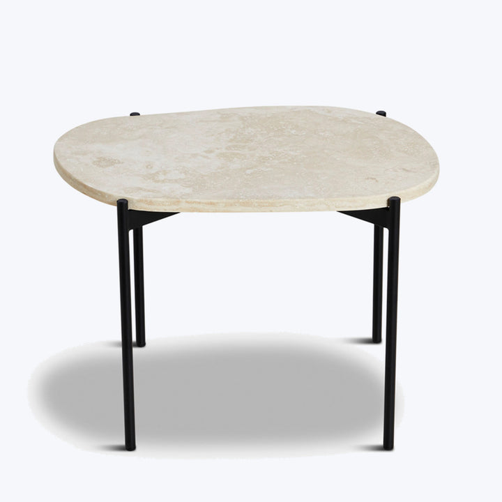 Organic stone-look table with black metal legs, minimalist design.