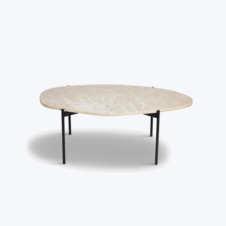 Modern coffee table with organic stone-like top and minimalistic legs.
