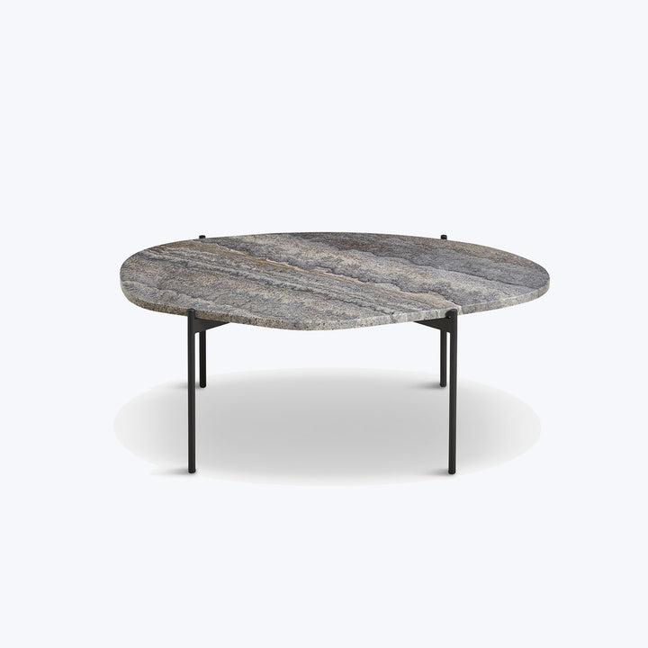 Modern coffee table with organic pebble shape and stone appearance.