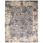 Rectangular area rug with distressed vintage floral and vine design.