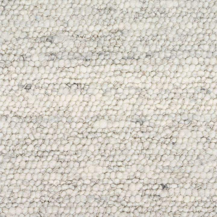 Close-up view of loop pile fabric in shades of gray.