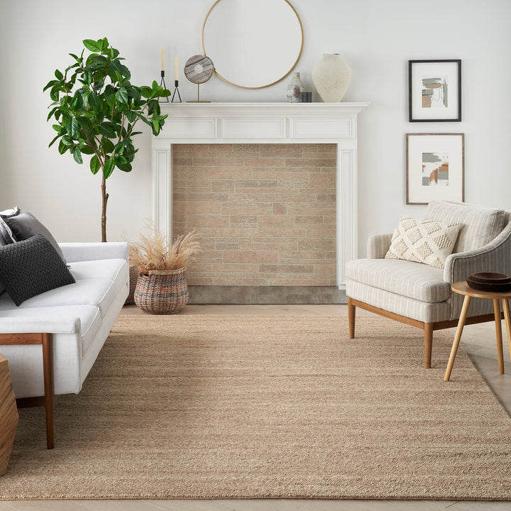 Modern living room with neutral palette, cozy furniture, and stylish decor.
