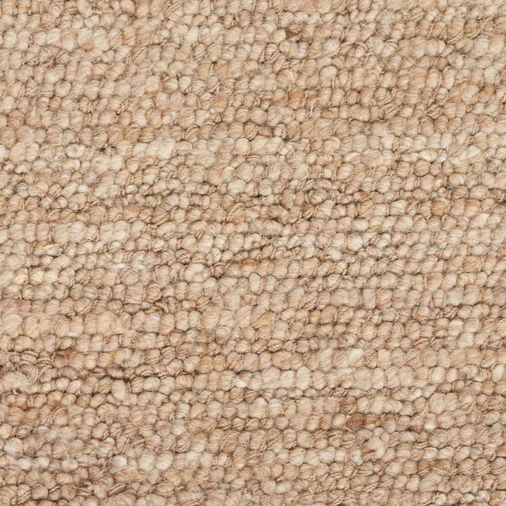 Close-up of textured surface with woven pattern in beige and brown.