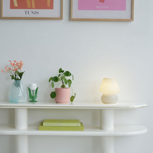 Unique hourglass-shaped vase with textured pattern and glossy finish. - hover