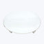 Simple round white ceramic plate with textured surface against white background.