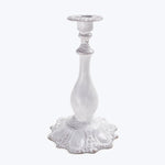 Vintage white and silver candlestick with ornate decorative design.