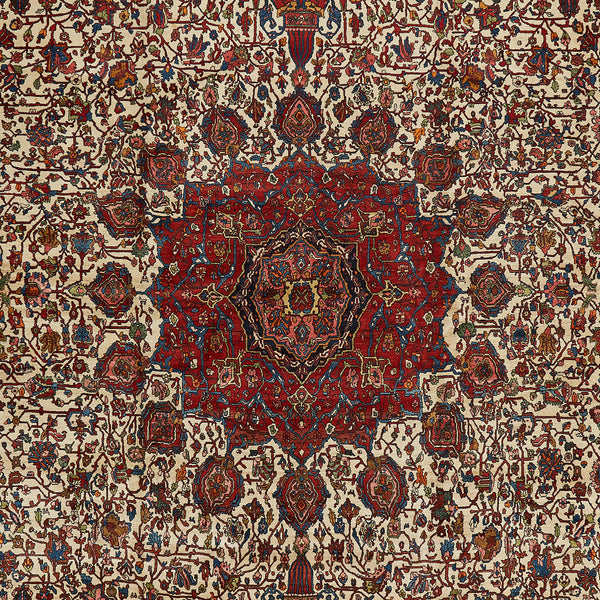 Elaborate Persian rug showcasing symmetrical floral and geometric patterns.