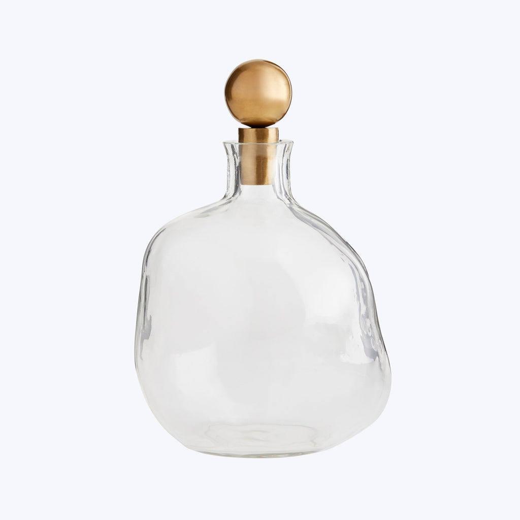 Elegant clear glass bottle with gold stopper for versatile use.