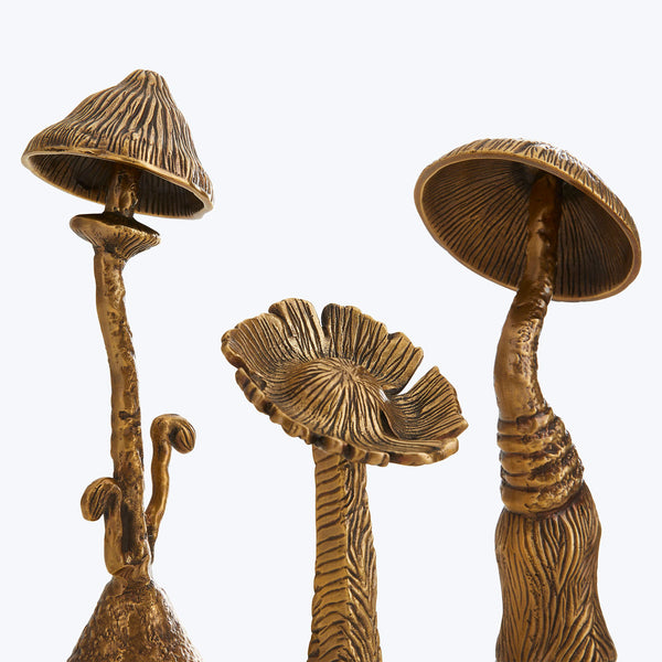 Bronze sculptures of stylized mushrooms showcase intricate craftsmanship and details.