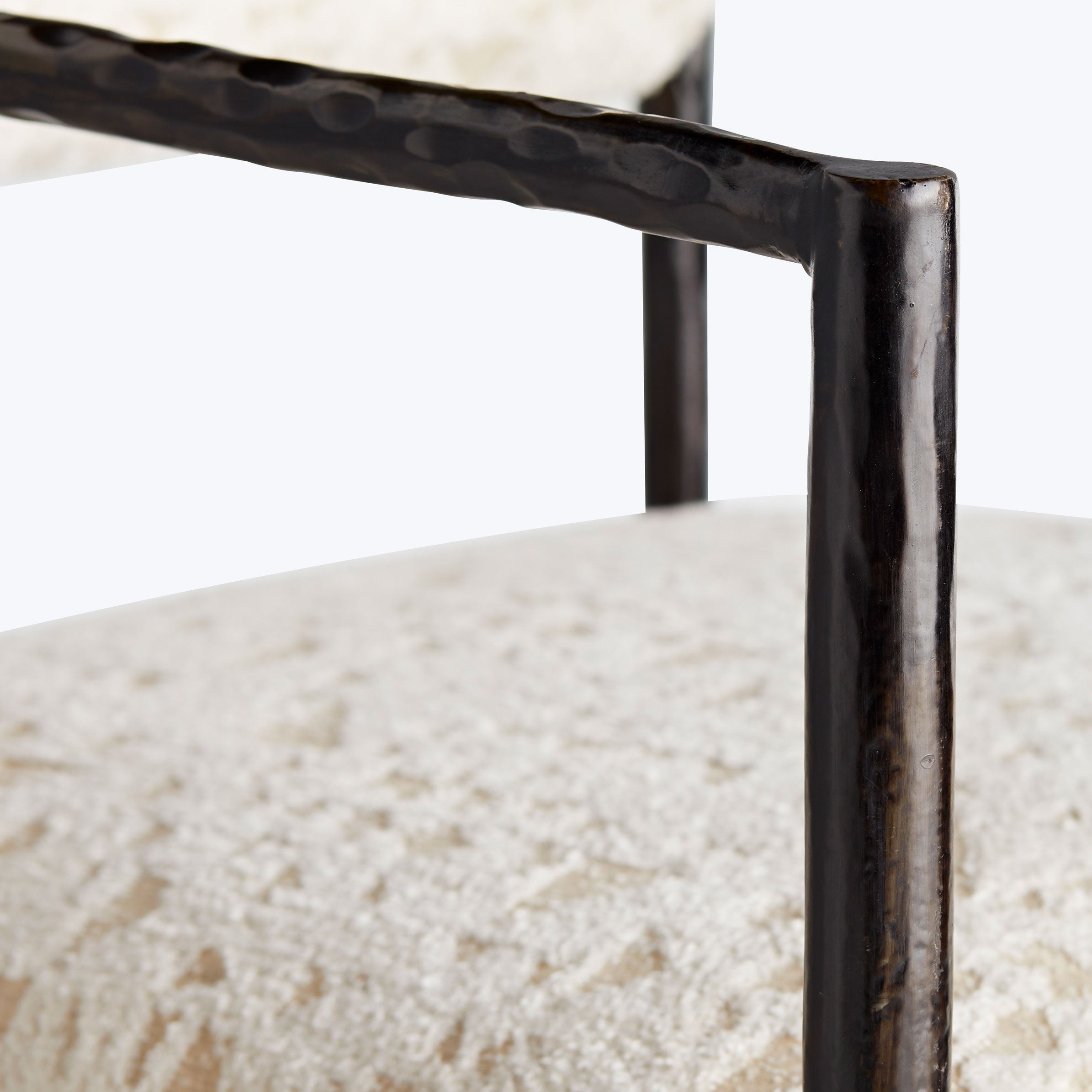 Close-up of an industrial-style chair showcasing its textured structure.