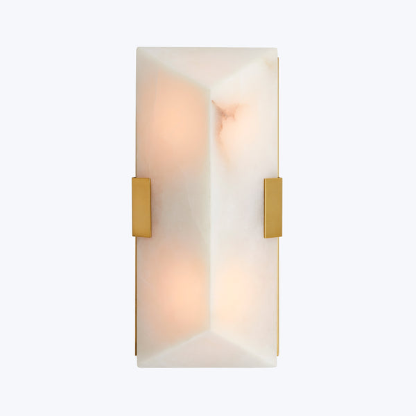 Wall-mounted light fixture with alabaster panels creates warm, ambient glow.