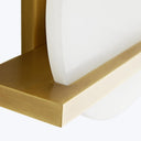 Close-up of a modern, white and gold object with smooth texture.