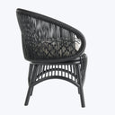 Modern-style chair with open weave design, suitable for indoor/outdoor use.