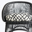 Contemporary black chair with open-weave back and geometric cushion pattern