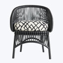 Modern-style armchair with black frame and geometric diamond pattern cushion