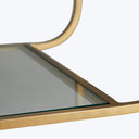 Elegant glass-topped furniture with polished edges and luxurious metallic frame.
