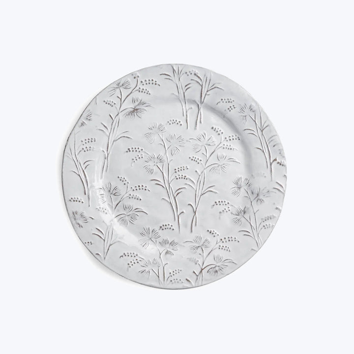 Decorative white ceramic plate with embossed botanical illustrations.
