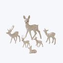 Seven glittery deer figurines in various sizes and poses. Festive decor.