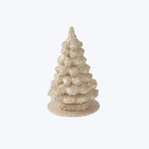 Glittery Christmas tree decoration adds festive sparkle to room display.