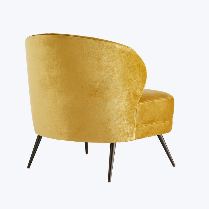 Stylish mustard yellow armchair with a plush velvet-like finish.