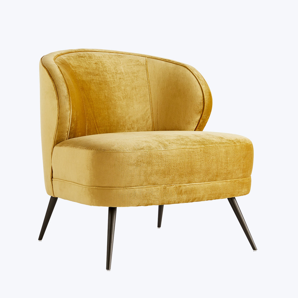 Opulent golden velvet chair with sleek design and luxurious comfort.