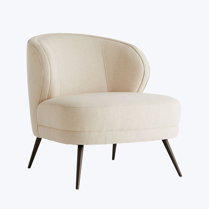 Contemporary armchair with curved backrest and elegant beige upholstery