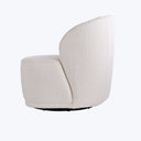 Contemporary chair with sculptural form and swivel base for comfort.