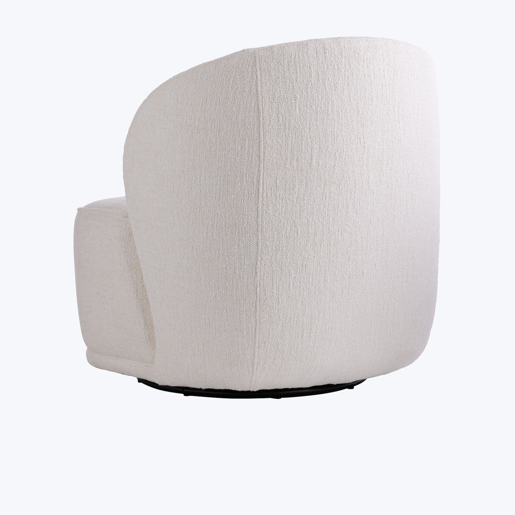Minimalist, comfortable chair with sleek design and neutral fabric color.