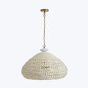 Elegant pendant light with a textured dome-shaped shade and brass finish.