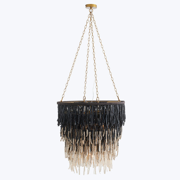 An elegant chandelier with cascading ombre beads adds sophistication.