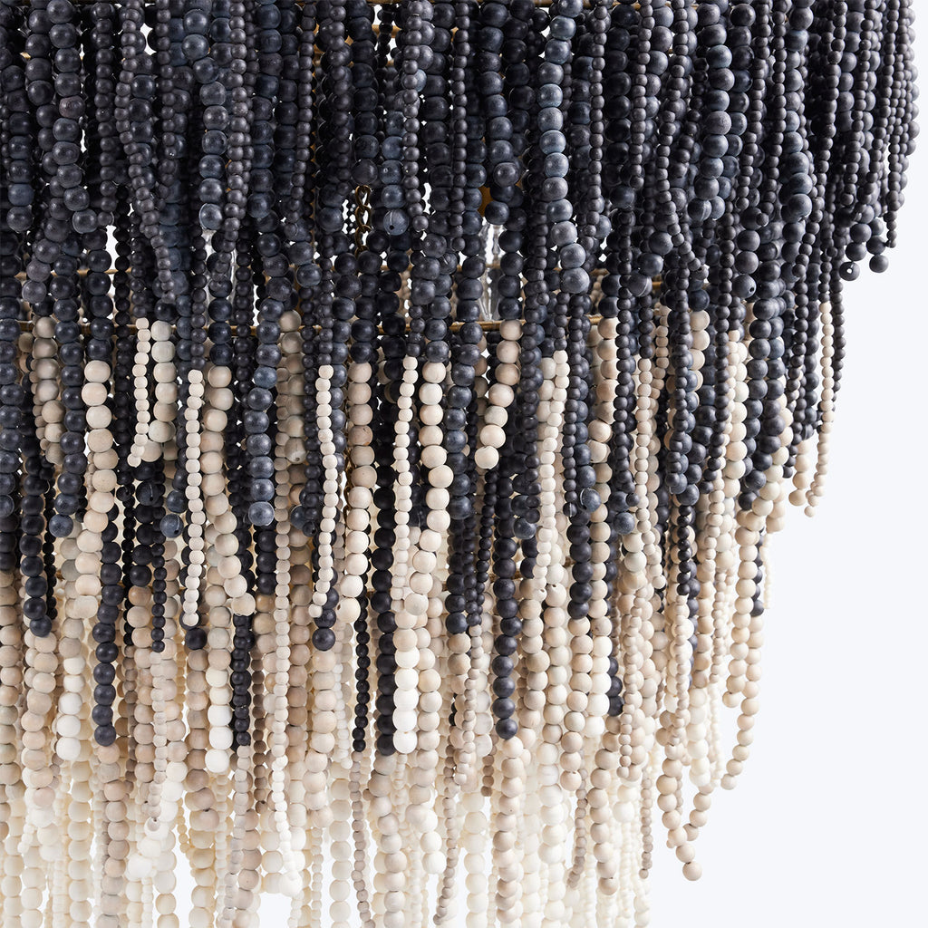 Vertical strands of tightly packed beads create a gradient curtain.