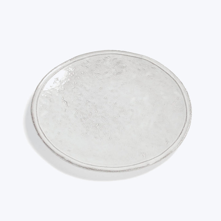 Handcrafted ceramic plate with rustic texture and white marbling effect