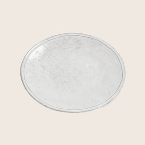 Handcrafted ceramic plate with rustic texture and white marbling effect