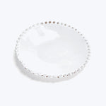 Elegant glass plate with beaded edge adds style to decor.