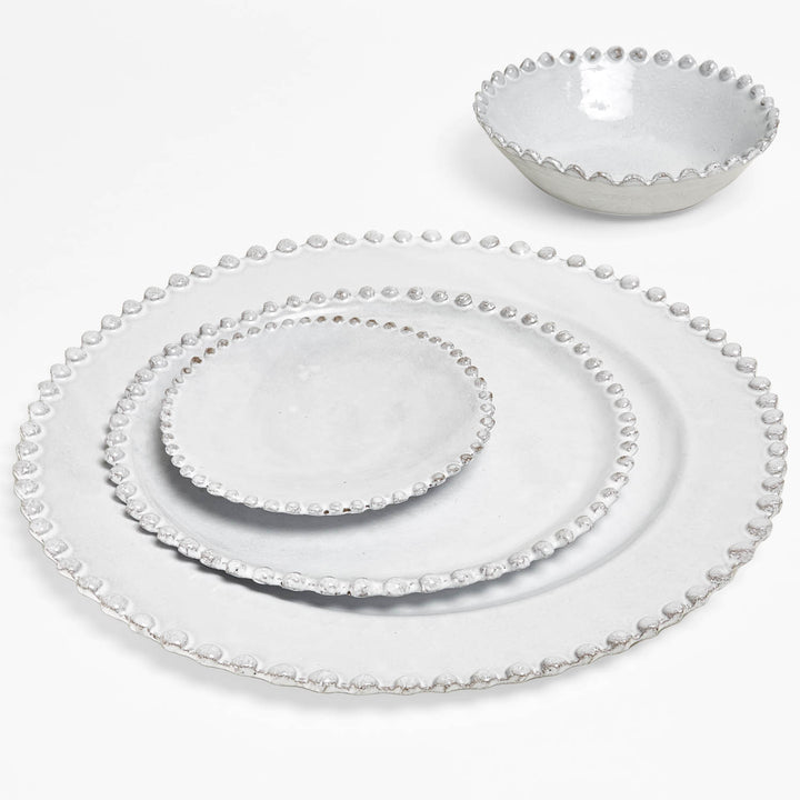 Elegant grey dinnerware set with beaded rim and matching bowl.