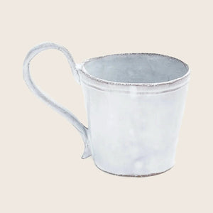 Rustic metal cup with handle, ideal for outdoor activities.