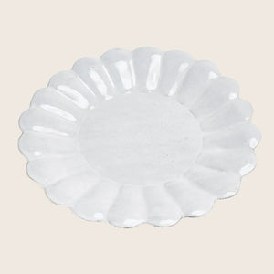 Elegant white ceramic plate with scalloped edges and decorative border.