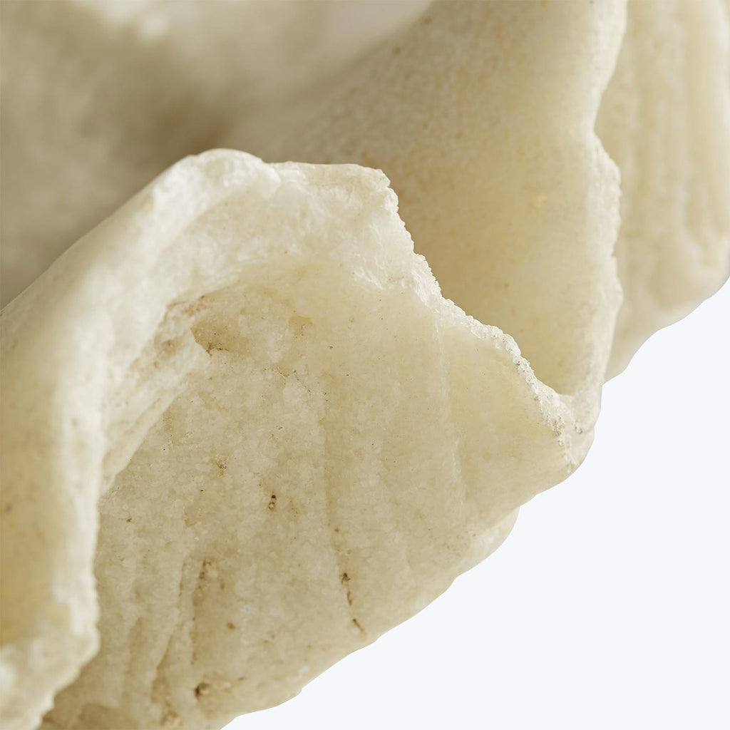 Pale, porous foam with irregular shapes and airy texture close-up