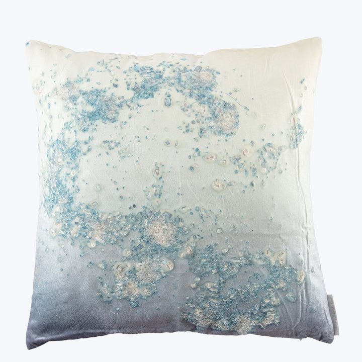 Square pillow with gradient design in blue, gray, and white