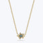 Elegant gold pendant necklace with blue gemstone and clear accents.