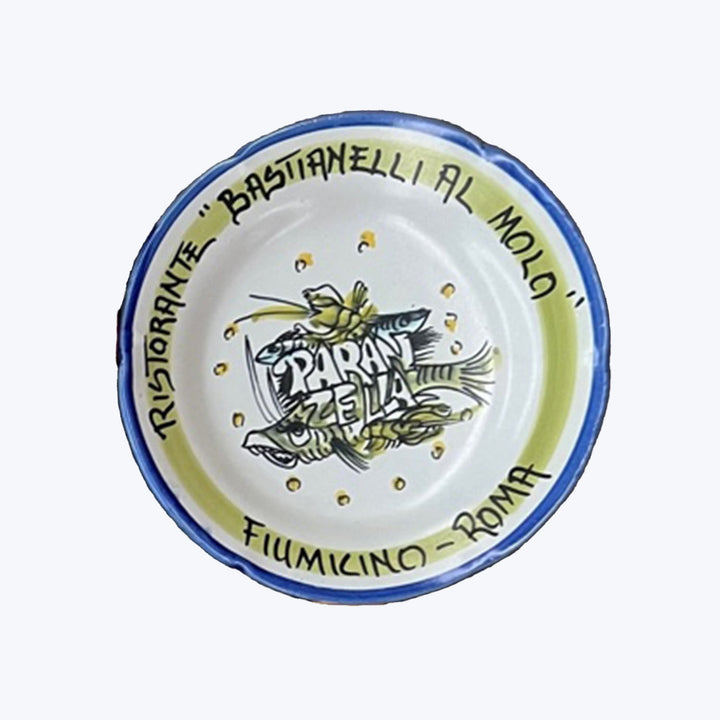 Italian seafood restaurant souvenir plate from Fiumicino, Roma with fish illustrations.