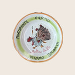 Colorful ceramic plate with chicken and food illustrations, restaurant-themed design.