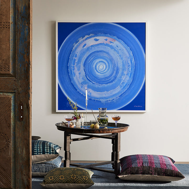 Aesthetic interior scene with a striking painting and rustic decor