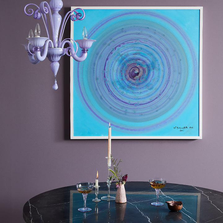 Elegantly decorated room with abstract painting and stylish décor accents.