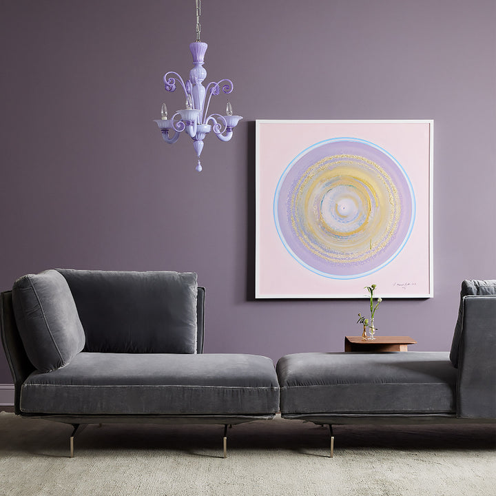 Contemporary living space featuring a purple accent wall and abstract artwork.