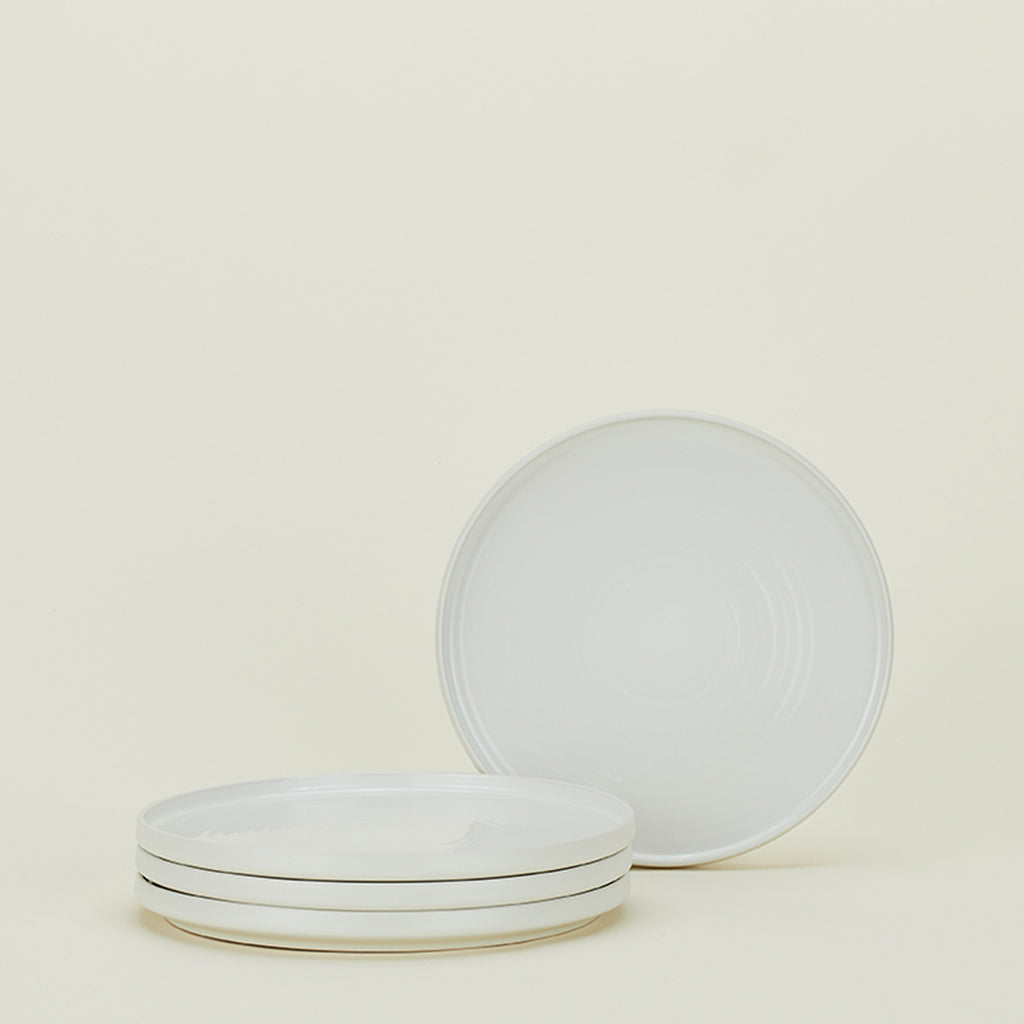 Minimalist white plates showcase simplicity and clean aesthetics.