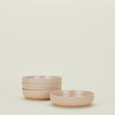 Minimalistic set of five beige bowls with contemporary Scandinavian design.