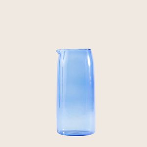 Minimalist blue glass jug with elegant design and subtle gradient