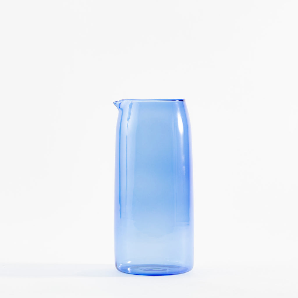 Minimalist blue glass jug with elegant design and subtle gradient
